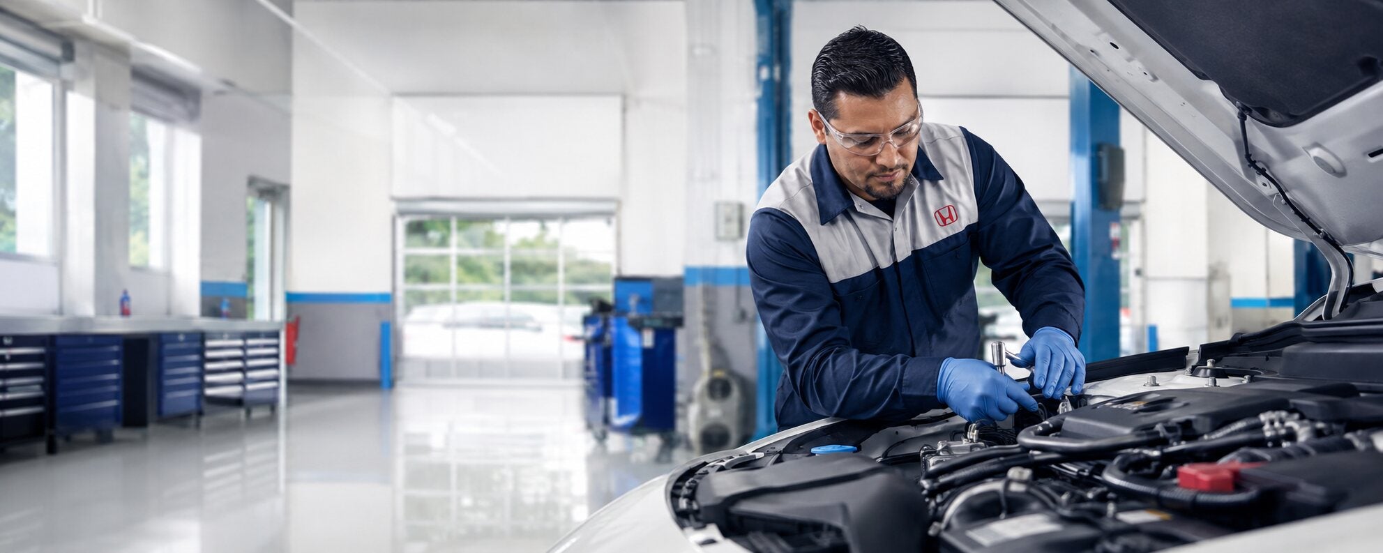 Honda technician servicing a vehicle
